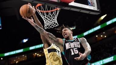 FILE PHOTO: Memphis Grizzlies forward Brandon Clarke (15) shoots against Washington Wizards center Alex Sarr (20) in the first half of an NBA basketball game, Dec. 20, 2025, in Memphis, Tenn.