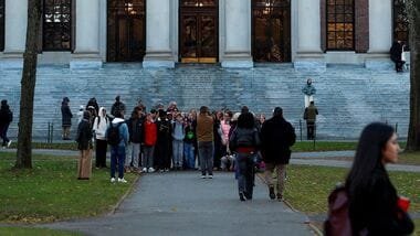 Students walk past Widener Library at Harvard University in Cambridge, Massachusetts, U.S., November 19, 2025. REUTERS/Reba Saldanha/File Photo