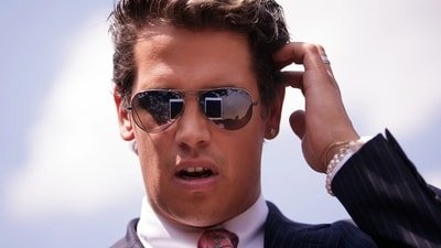 Milo Yiannopoulos, known for his conservative views, was taken into custody by ICE for exceeding his visa duration. (X)