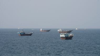 Vessels near the Strait of Hormuz, as seen from Musandam, Oman, August 17, 2026.