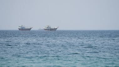 Vessels near the Strait of Hormuz, as seen from Musandam, Oman, August 6, 2026. REUTERS/Stringer