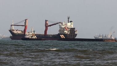 Vessels are seen in the Strait of Hormuz, off the port city of Bandar Abbas in southern Iran on August 10, 2026.  (Photo by Atta KENARE / AFP) /