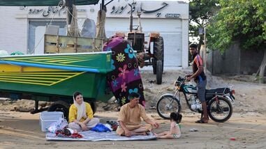 An Iranian family enjoys the seaside in the port city of Bandar Abbas, in southern Iran on August 10, 2026.