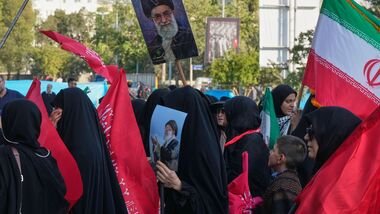 Mourners arrive to attend a ceremony marking 40 days since the burial of the late Supreme Leader Ayatollah Ali Khamenei at the Imam Khomeini Grand Mosalla in Tehran, Iran, Tuesday, Aug. 18, 2026. (AP Photo/Vahid Salemi)