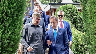 Jammu and Kashmir Chief Minister Omar Abdullah in conversation with US Ambassador to India Sergio Gor, in Srinagar on Wednesday. (ANI) (ANI)