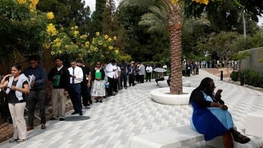 A file photo of job seekers at the HIRE360 Diversity Hiring Expo at the Carson Event Center in Carson, California.