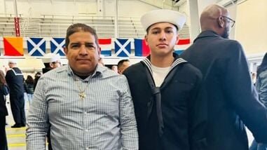 File image of US Navy sailor Joshua Aviles (R) with his father, Luis Manuel Aviles Roa (L)
