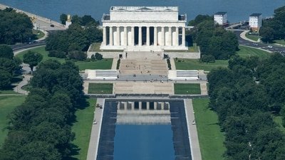 Water begins to refill the Lincoln Memorial Reflecting Pool, Friday, Aug. 7, 2026, in Washington. (AP Photo/Allison Robbert)