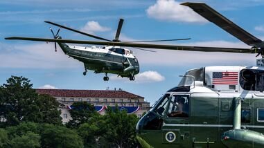Marine One, left, with President Donald Trump aboard, lifts off from the Ellipse, Tuesday, Aug. 4, 2026, in Washington. (AP Photo/Alex Brandon)