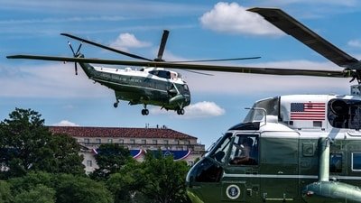 Marine One, left, with President Donald Trump aboard, lifts off from the Ellipse (AP Photo/Alex Brandon)