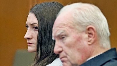 Lindsay Clancy and Kevin Reddington listen to the closing arguments by Jennifer Sprague in the Lindsay Clancy triple murder case in Plymouth Superior Court, in Plymouth, Massachusetts. (REUTERS)