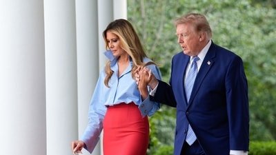 US First Lady Melania Trump, left, and US President Donald Trump arrive for a Fostering the Future event in the Rose Garden of the White House in Washington, DC, US, on Thursday, Aug. 20, 2026. Photographer: Yuri Gripas/Abaca/Bloomberg (Bloomberg)
