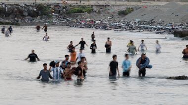 Migrants cross into Ceuta by sea, at El Tarajal beach, amid mass crossings of migrants from Morocco into Spanish territory, in Ceuta, Spain, July 31, 2026. REUTERS/Jon Nazca
