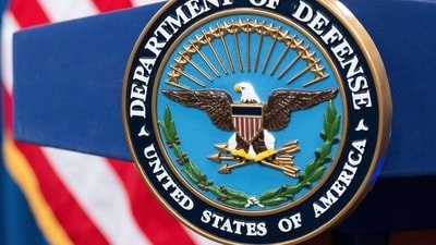 The Department of Defense seal is seen on the podium in the Press Briefing room at the Pentagon. (AP Photo)