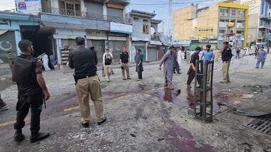 Police officers examine the site following a suicide bombing, in Kabal, a town in the Swat Valley in Pakistan's Khyber Pakhtunkhwa province, Sunday, Aug. 2, 2026. (AP Photo/Sherin Zada)