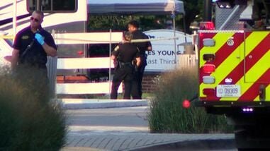 This image taken from video and provided by WTVQ shows officers at the scene of a shooting at Charles Young Park in Lexington, Ky., Saturday, Aug. 15, 2026. (WTVQ via AP)