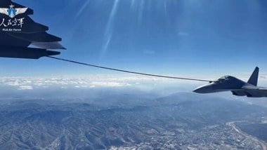 A Chinese PLA Air Force J-16 fighter jet is being refueled in mid-air by a YY-20A aerial refueling aircraft during an intercontinental deployment to Egypt for the Eagles of Civilization 2026 joint training in August 2026.