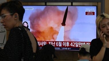 News coverage showing file footage of a North Korean missile launch is seen on a screen at a train station in Seoul on August 6, 2026. North Korea fired a short-range ballistic missile over the Sea of Japan on August 6,