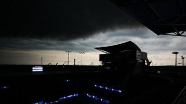 Aug 11, 2026; Mason, OH, USA;  The P&G Stadium Court is silhouetted as storm clouds gather during the Cincinnati Open at Lindner Family Tennis Center.