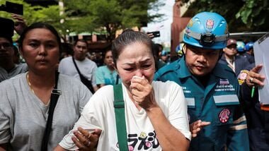 A relative of a victim reacts at Debsirin Nonthaburi School following the shooting incident that took place at the school in Bang Kruai district, Nonthaburi province, on the outskirts of Bangkok, Thailand.