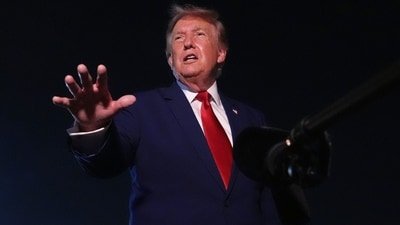 President Donald Trump talks to reporters after arriving on Air Force One Tuesday, Aug. 11, 2026, at Joint Base Andrews, Md. (AP Photo/Mark Schiefelbein) (AP Photo/Mark Schiefelbein)