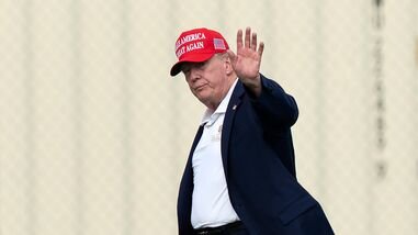 US President Donald Trump waves to the media as he walks from Marine One to his limousine upon his arrival at the Ellipse just outside of the White House, Sunday, Aug. 16, 2026, in Washington.