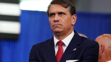 Attorney General Todd Blanche listens as President Donald Trump speaks at the David Mack Center for Training and Intelligence, Friday, Aug. 14, 2026, in Garden City, N.Y. (AP Photo/Julia Demaree Nikhinson)