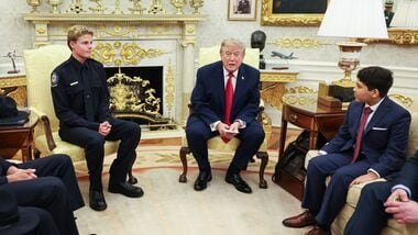 US President Donald Trump hosts lifeguard Ryder Williams, left, in the Oval Office of the White House in Washington, DC, US, on Monday, Aug. 17, 2026. Ryder Williams, a 16-year-old lifeguard, saved the life of 10-year-old Nathaniel Rai at Seabright Beach in Santa Cruz, California, on July 25. Photographer: Samuel Corum/Sipa/Bloomberg