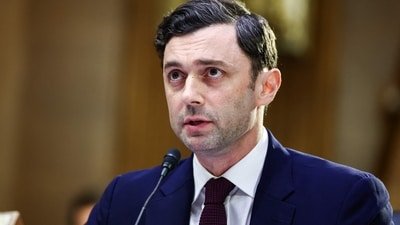 Senator Jon Ossoff criticized President Trump for focusing on personal travel with aide Natalie Harp instead of addressing vital issues like the conflict in Iran. (Getty Images via AFP)