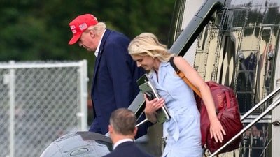 Natalie Harp, dubbed 'human printer' for her pro-Trump article printing, has gained attention for her Ivanka-esque style. (AFP)