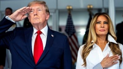 President Donald Trump with first lady Melania Trump during the National Anthem at the start of the Freedom 250 Grand Prix race. Doug Mills/Pool via REUTERS (via REUTERS)