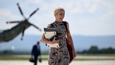 U.S. President Donald Trump's executive assistant Natalie Harp has come into focus amid a report saying she jumped into the trunk of a SUV to travel with the president's motorcade. (REUTERS)
