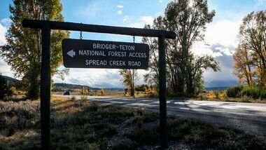 A sign gives directions to the Bridger-Teton National Forest on Sept. 19, 2021 in Wyoming.